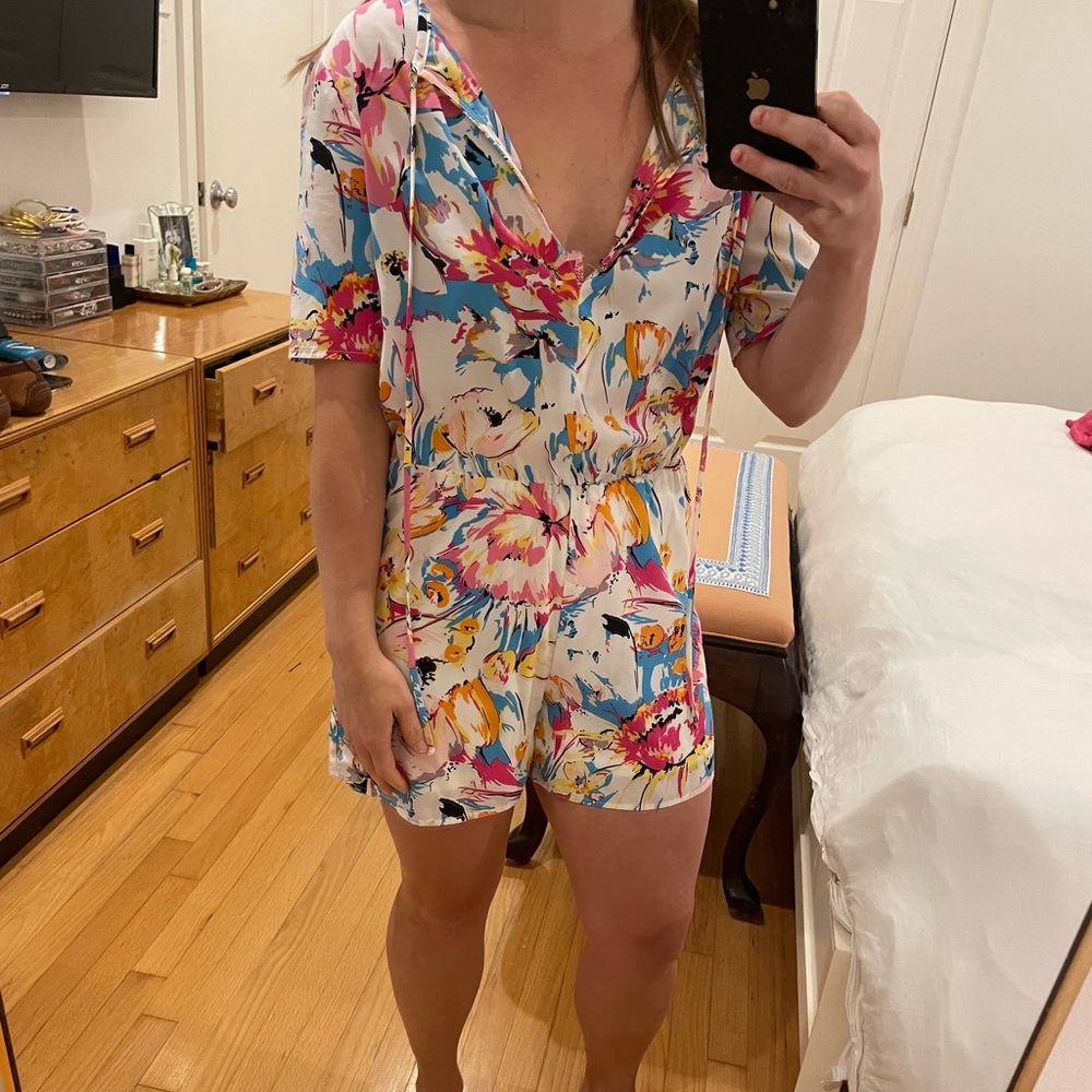 Romper with blue pink and yellow pattern with pockets. Charles Henry xs